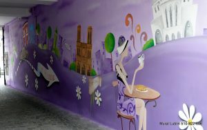 Kolorowy mural w kreskówkowym klimacie, mural w Lublinie Tart Yvonne mural reklamowy