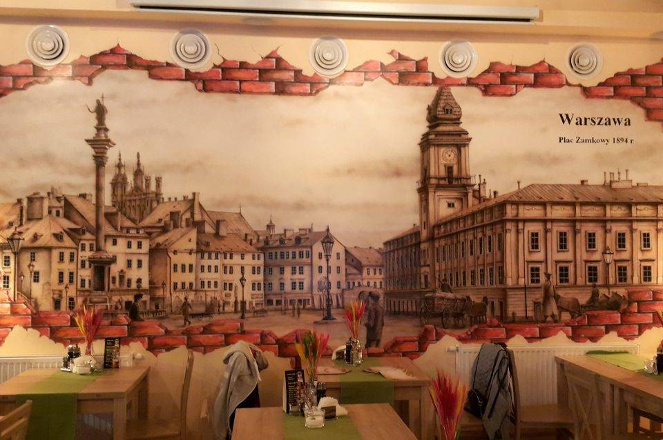 Mural Panorama warszawy namalowana w restauracjii